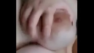 Youthfull chick toying with boobs